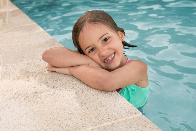 Medium shot girl posing at pool