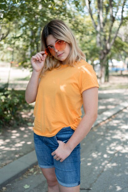 Free photo medium shot girl posing with cool glasses