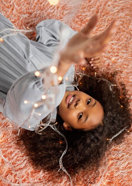 Medium shot girl posing with lights  top view