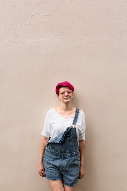 Medium shot girl posing with wall