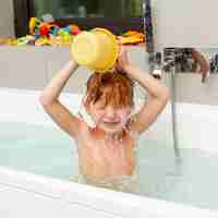 Free photo medium shot girl pouring water with little bucket