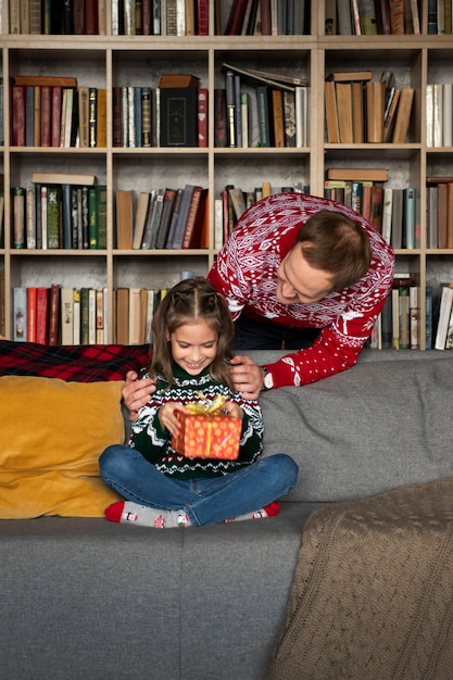 Medium shot girl receiving gift