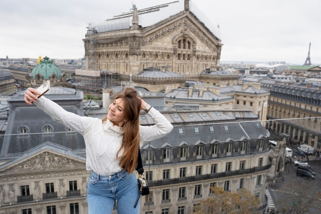 Medium shot girl taking selfie