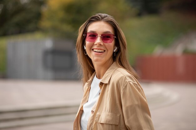 Medium shot girl wearing glasses