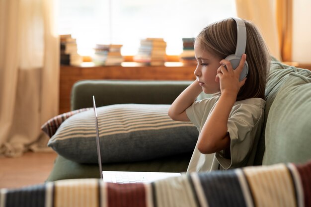 Medium shot girl wearing headphones