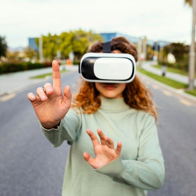 Medium shot girl wearing vr glasses