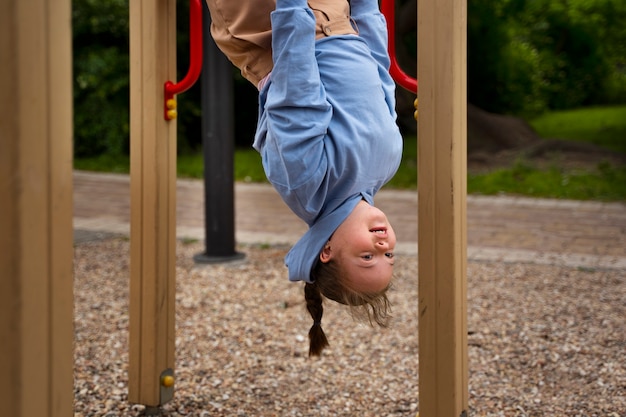 Medium shot girl with down syndrome playing