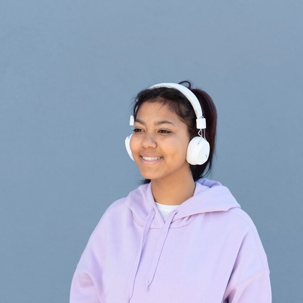 Medium shot girl with headphones