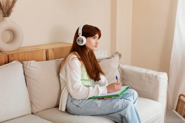 Medium shot girl with headphones