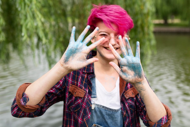 Medium shot girl with sparkle on palms