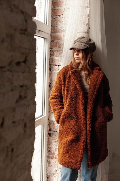 Free photo medium shot girl with warm coat and hat