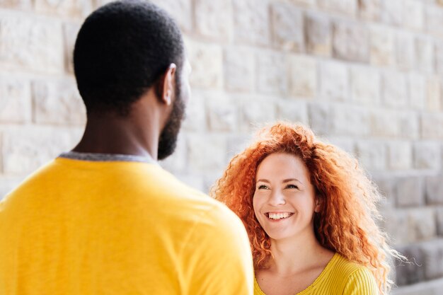 Medium shot of girlfriend smiling at boyfriend