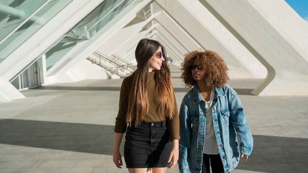 Medium shot girls taking a walk