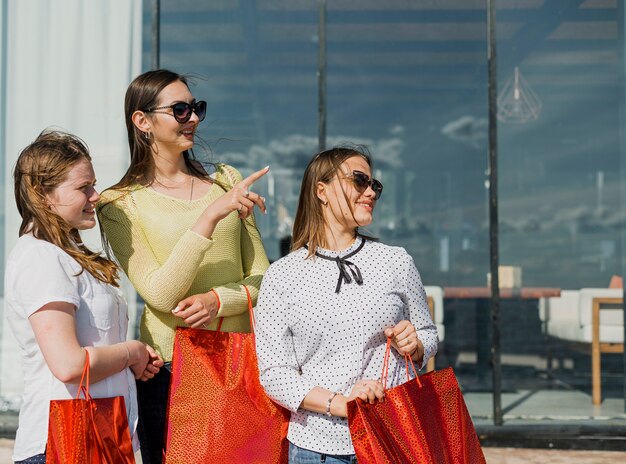 Medium shot girls with shopping bags