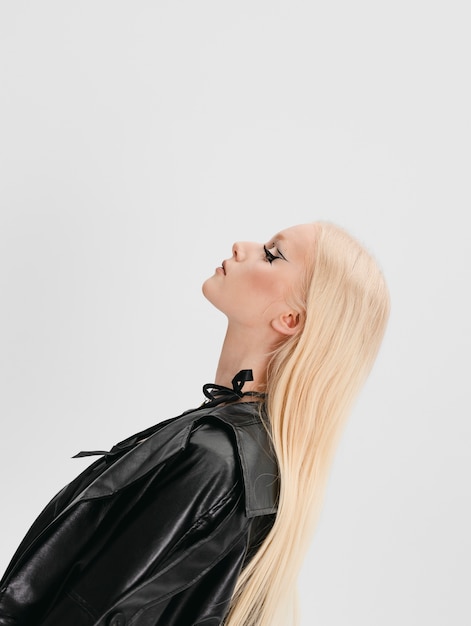 Medium shot goth teenager posing in studio