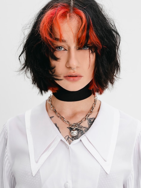 Medium shot goth teenager posing in studio