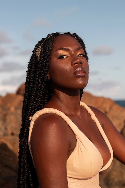 Free photo medium shot greek goddess posing in nature