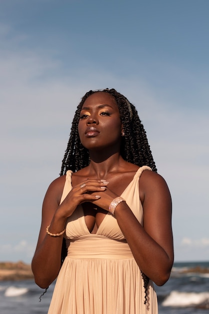 Medium shot greek goddesses posing at the beach