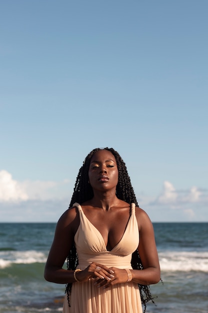 Medium shot greek goddesses posing at the beach