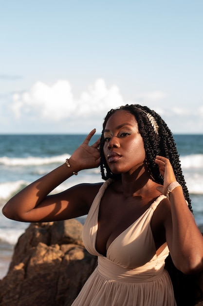 Medium shot greek goddesses posing at the beach