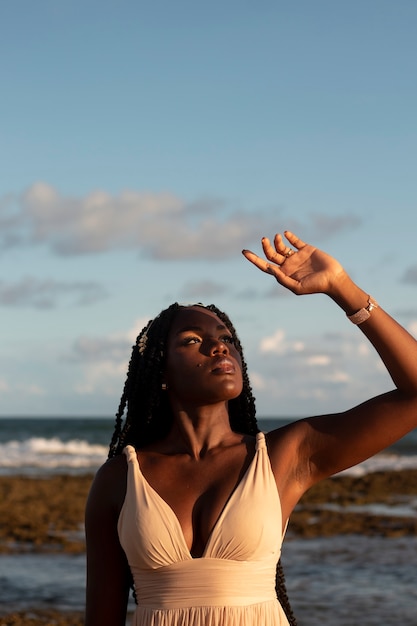 Medium shot greek goddesses posing at the beach