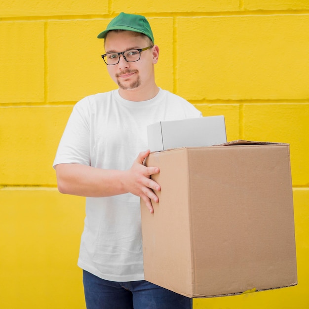 Medium shot guy holding boxes