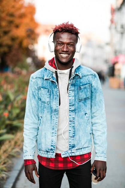 Medium shot guy posing with wide smile