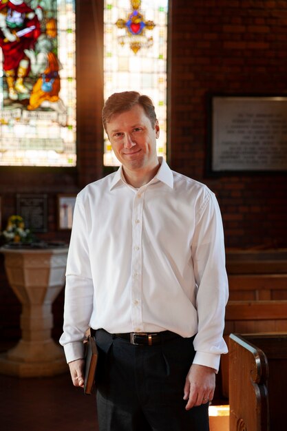 Medium shot happy christian man at church