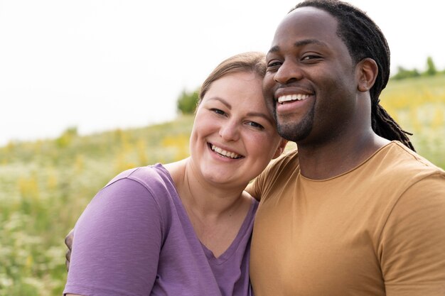 Medium shot happy couple posing