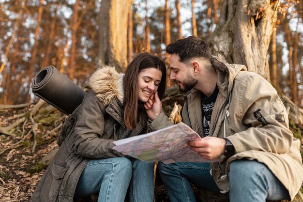 Medium shot happy couple with map