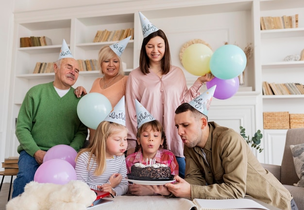 Medium shot happy family celebrating girls