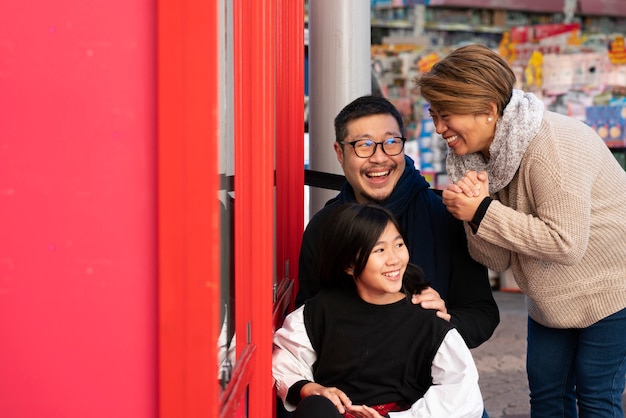 Medium shot happy family at market