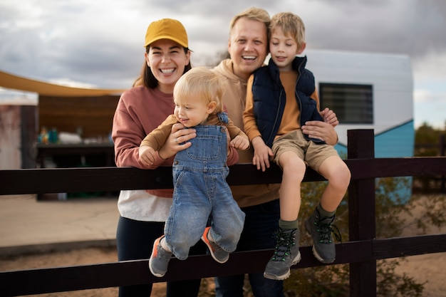 Free photo medium shot happy family outdoors