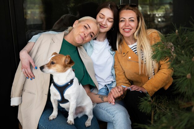 Medium shot happy family with dog