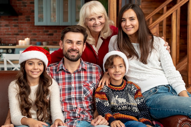 Medium shot happy family with grandmother