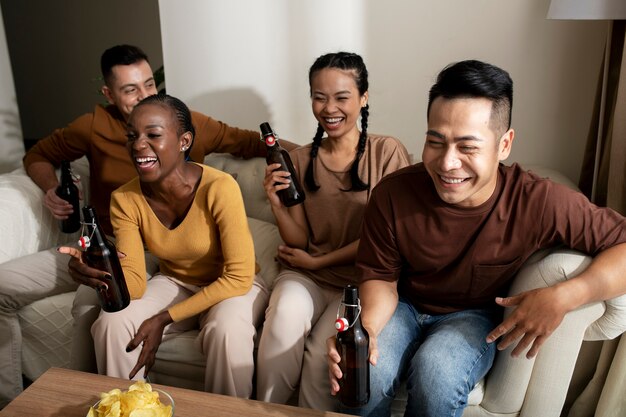 Medium shot happy friends holding drinks