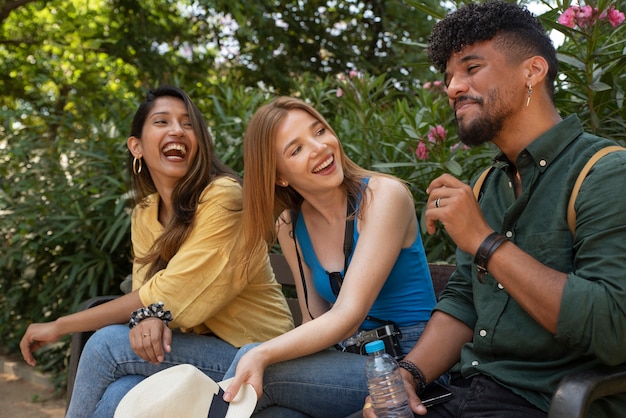 Medium shot happy friends outdoors