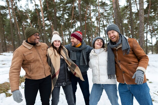 Medium shot happy friends reunion winter season