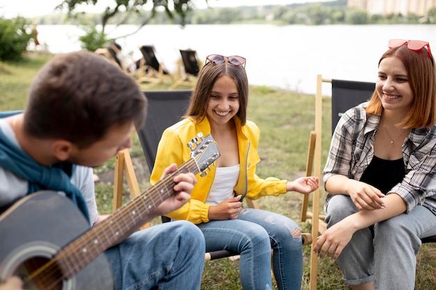 Medium shot happy friends with music