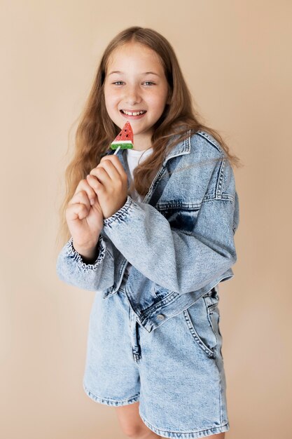 Medium shot happy girl posing with ice cream