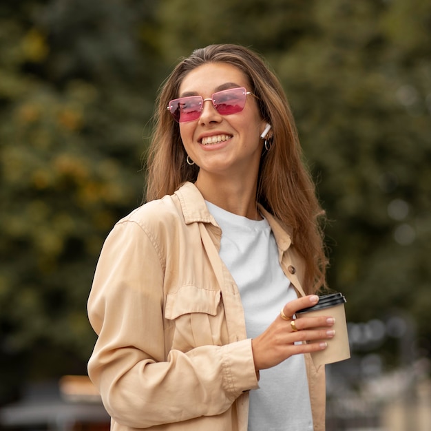 Medium shot happy girl with coffee