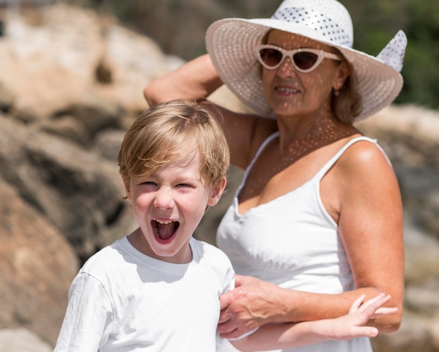 Medium shot happy grandma and kid