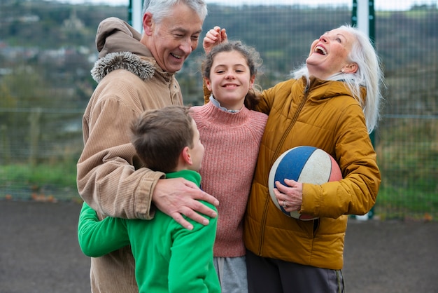 Medium shot happy grandparents and kids