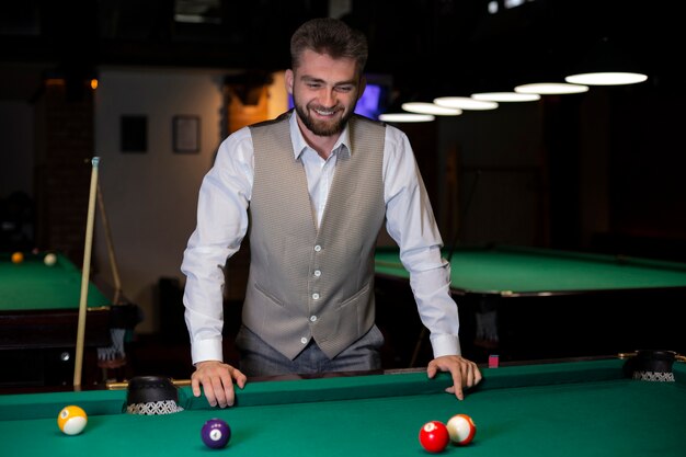 Medium shot happy guy with grey vest