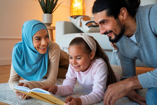 Medium shot happy islamic family at home