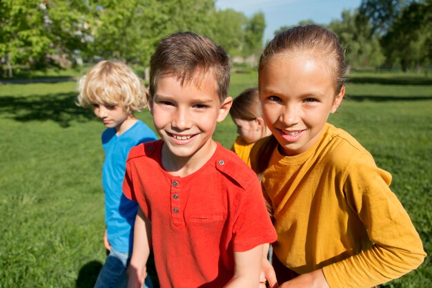 Medium shot happy kids outside