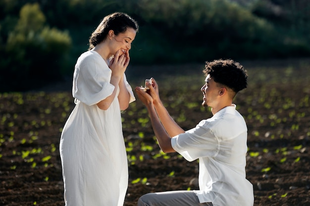 Free photo medium shot happy man proposing