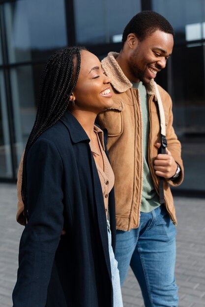 Medium shot happy partners walking together