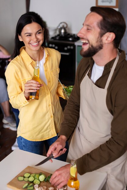 Medium shot happy people cooking