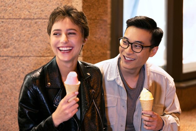 Medium shot happy people holding ice cream